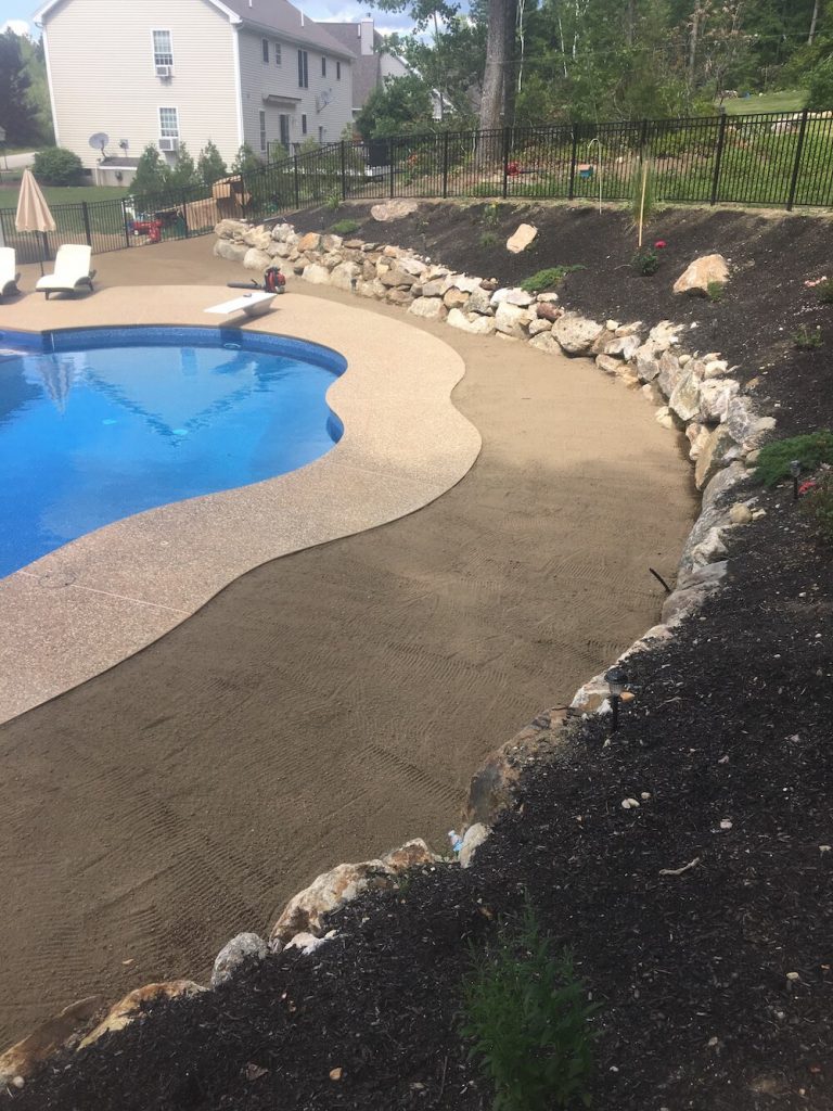 Wide view for loam, rock wall, pool