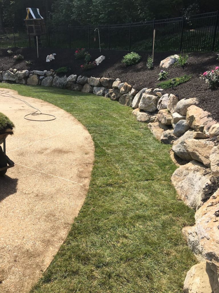 Sod instillation, rock wall, pool