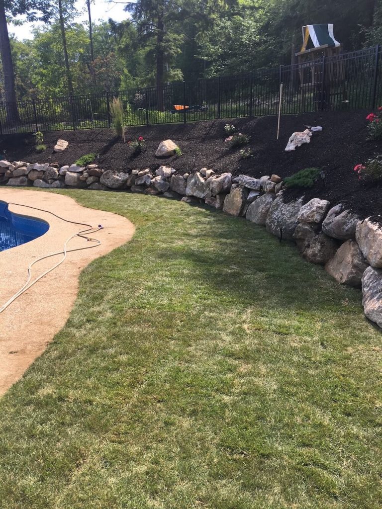Sod instillation around rock wall